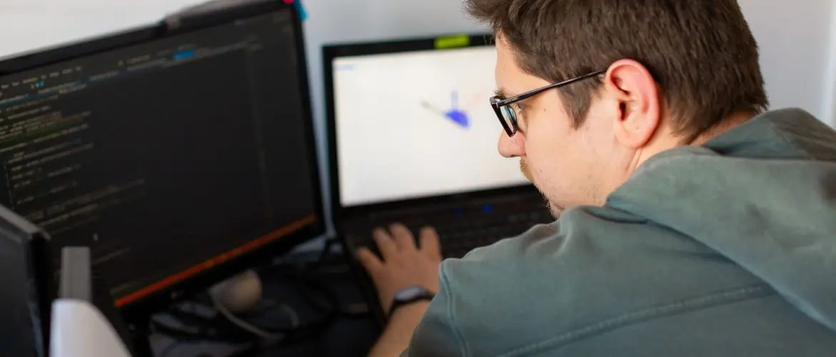 iot, software developer using laptop